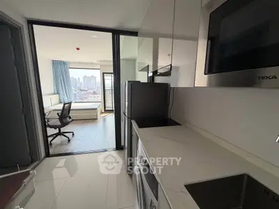 Modern apartment kitchen with city view and bedroom access