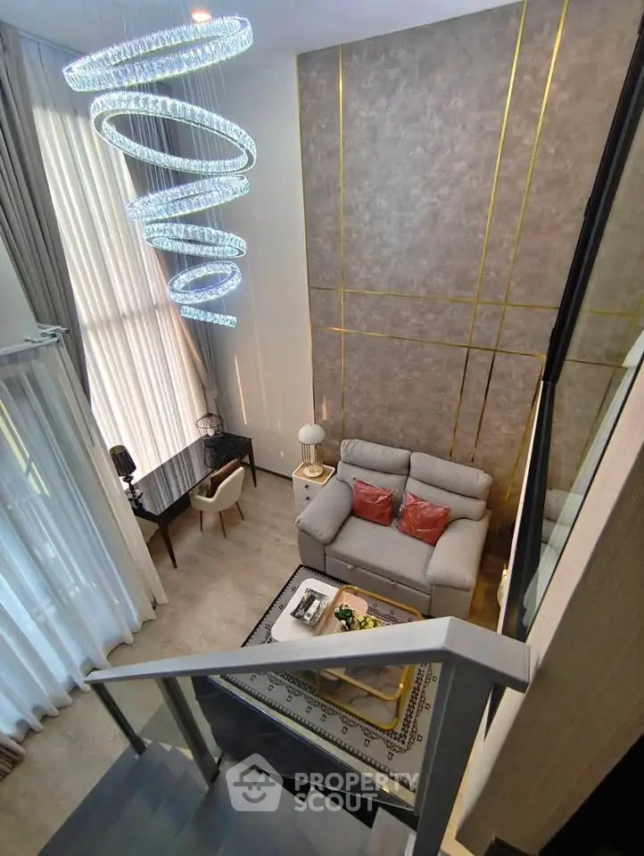 Luxurious modern living room with high ceiling and elegant spiral chandelier