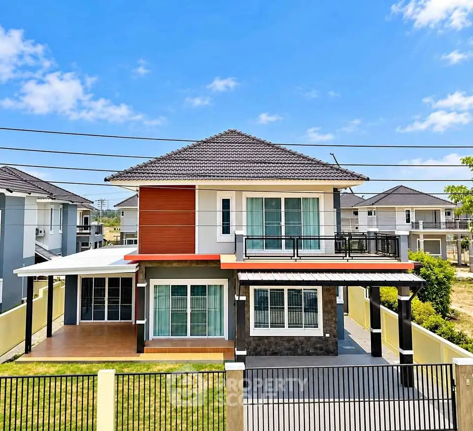 Stunning modern two-story house with spacious balcony and elegant facade in a serene neighborhood.