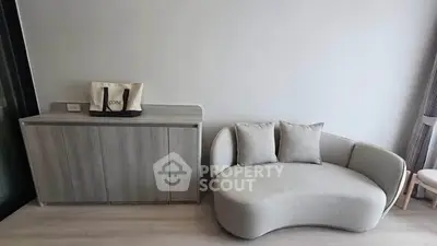Modern living room with stylish sofa and sleek cabinet