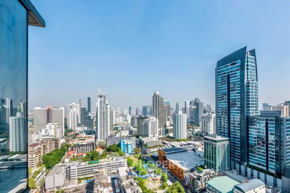 Stunning cityscape view from a high-rise building showcasing modern architecture and vibrant urban life.