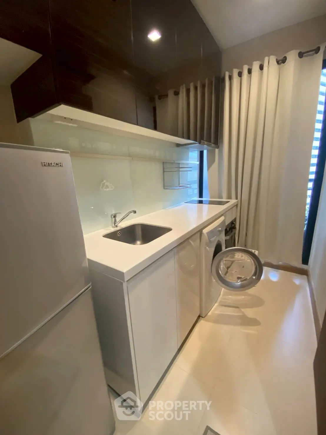 Modern kitchen with sleek appliances and ample storage space