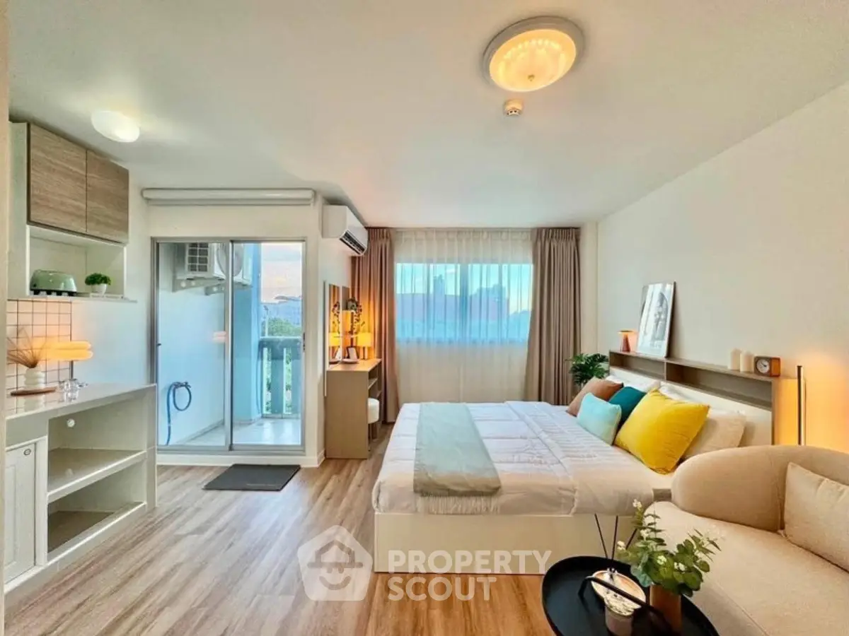 Spacious modern bedroom with balcony access and stylish decor
