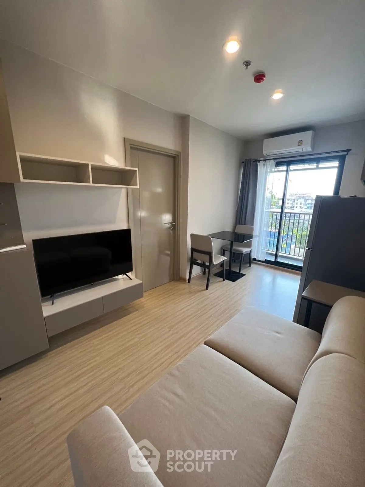 Modern living room with balcony view and stylish furniture