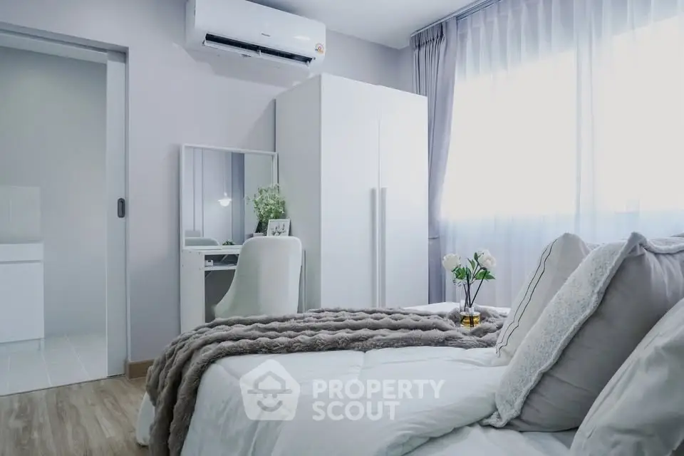 Modern bedroom with cozy decor and natural light