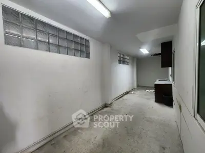 Spacious storage room with high ceiling and ample lighting