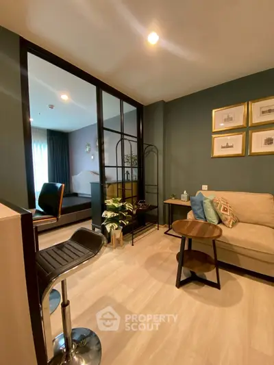 Modern living room with stylish decor and cozy seating area in an elegant apartment.