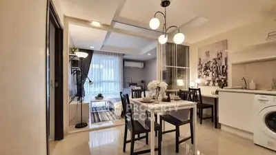 Modern open-plan living and dining area with stylish decor and natural light.