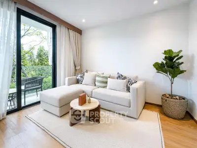 Modern living room with cozy sofa and balcony view, perfect for relaxation and entertaining.