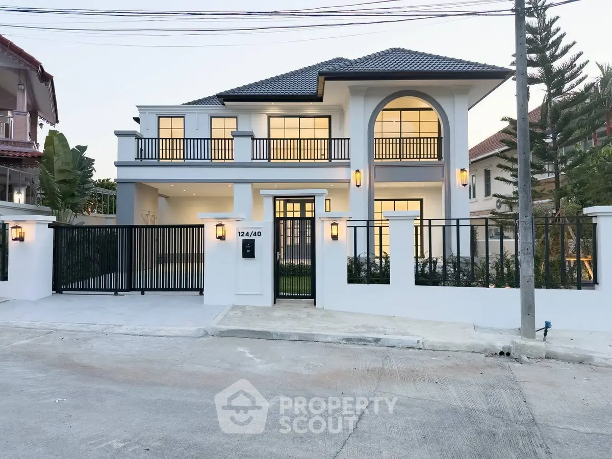 Stunning modern two-story house with elegant facade and spacious driveway in a serene neighborhood.