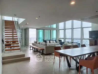 Luxurious modern living room with panoramic city views and elegant staircase