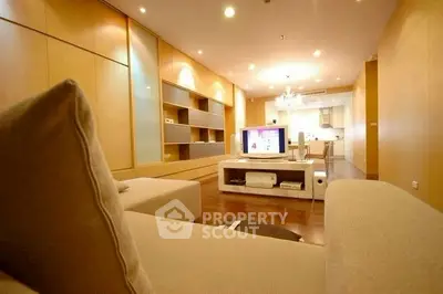 Spacious modern living room with elegant lighting and open layout.