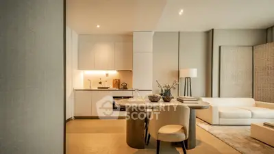 Luxurious modern living room with open kitchen, elegant furniture, and ambient lighting.