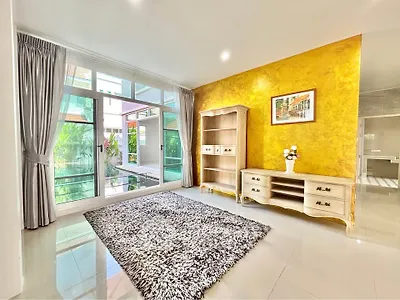 Spacious living room with large windows and elegant decor in modern home