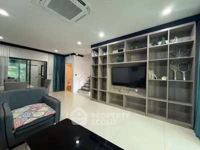 Spacious modern living room with built-in shelving and stylish decor
