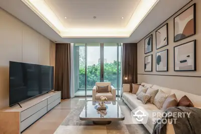 Luxurious modern living room with large TV and stylish decor overlooking greenery.