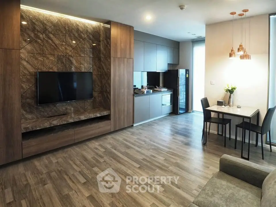 Modern open-plan living room with stylish kitchen and dining area