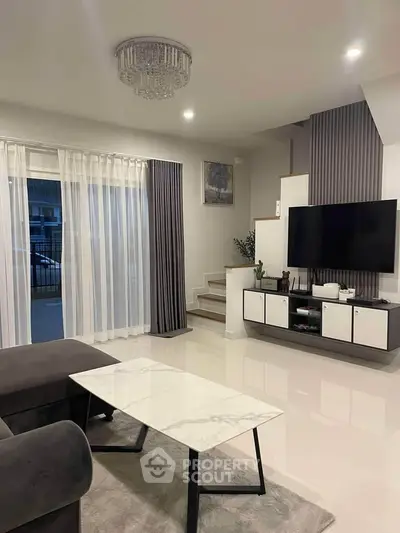 Modern living room with sleek decor and elegant lighting