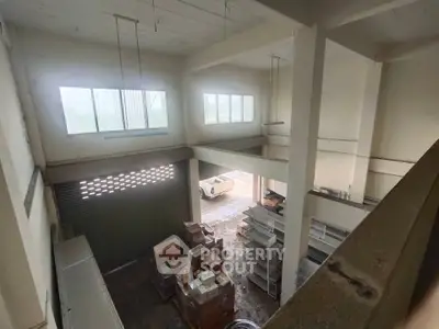 Spacious industrial warehouse with high ceilings and ample storage space.