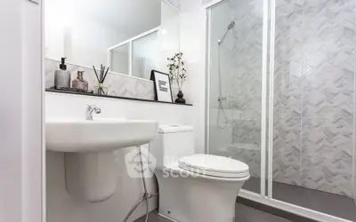 Modern bathroom with sleek fixtures and glass shower enclosure