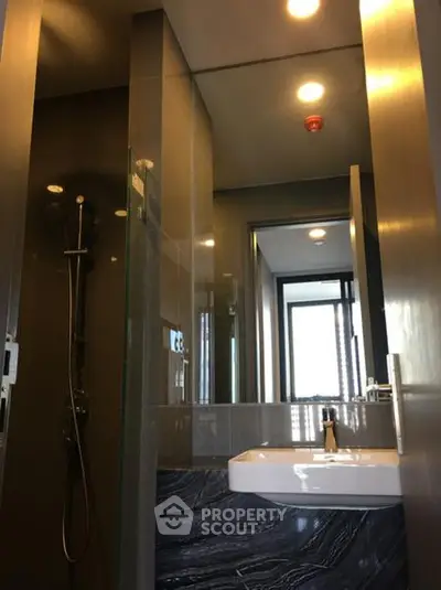 Modern bathroom with sleek design and glass shower enclosure