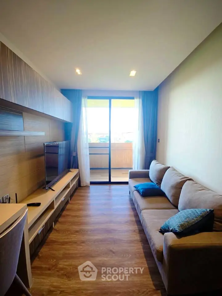 Modern living room with cozy sofa and balcony view