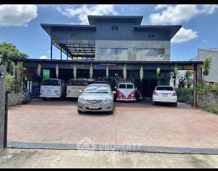 Spacious property with ample parking and unique architectural design.