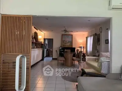 Spacious living room with cozy seating and elegant decor