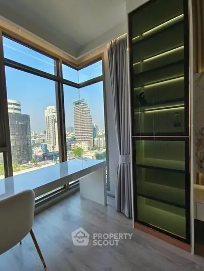 Modern high-rise apartment with stunning city view and sleek interior design.