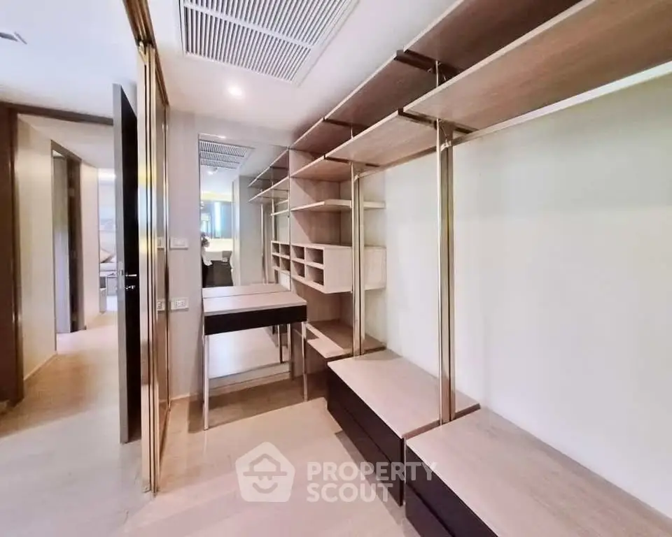 Spacious walk-in closet with modern shelving and ample storage space