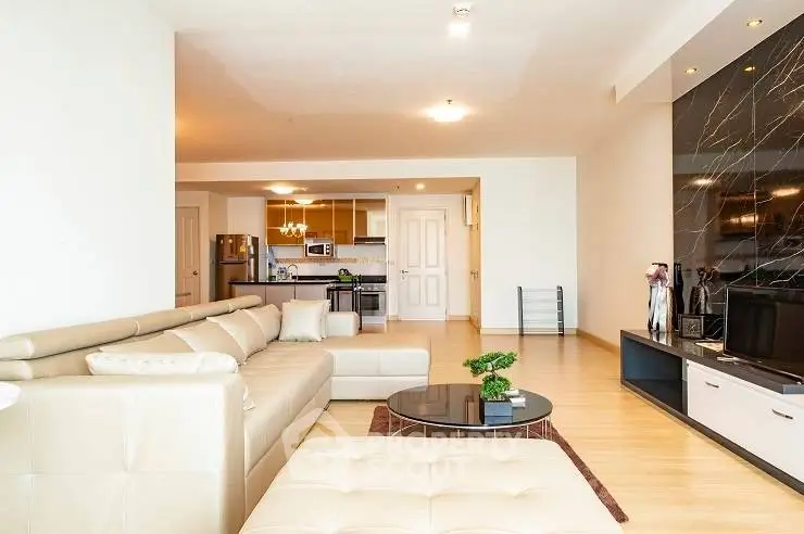Spacious modern living room with open kitchen and elegant decor