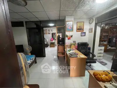 Spacious home office with traditional decor and ample natural light