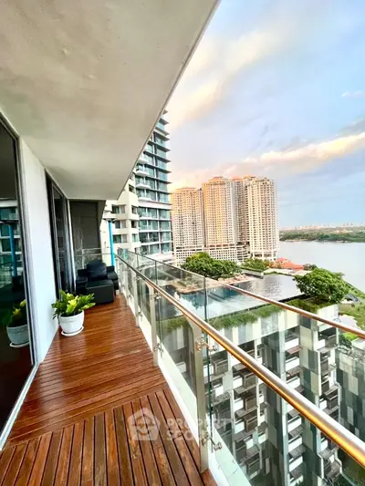 Stunning high-rise balcony with breathtaking city and river views, perfect for relaxation and entertainment.