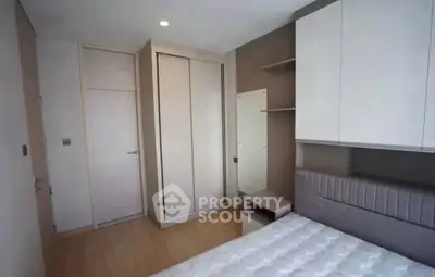 Modern bedroom with sleek wardrobe and minimalist design