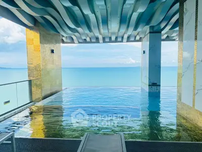 Luxurious infinity pool with stunning ocean view in modern high-rise building.