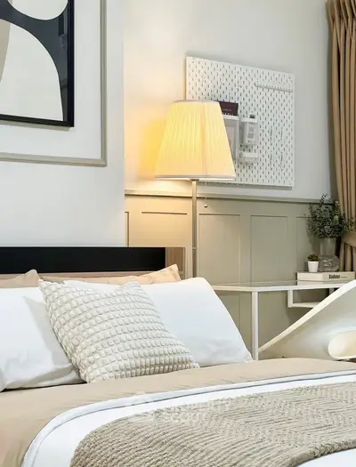 Elegant bedroom with modern decor and cozy lighting, perfect for relaxation and comfort.