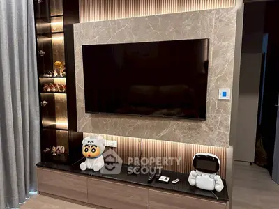 Modern living room with sleek TV setup and stylish shelving