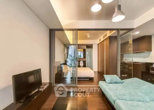 Modern studio apartment with open layout and sleek furnishings