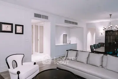Elegant living room with modern furniture and stylish lighting in a luxury apartment.