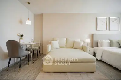 Modern living room with elegant decor and cozy seating area in a stylish apartment.