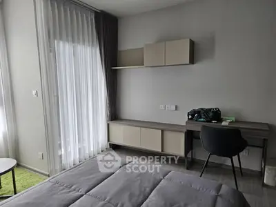 Modern bedroom with sleek furniture and natural light