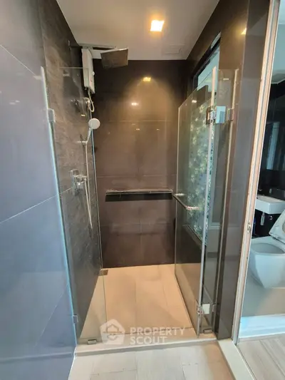Modern bathroom with glass shower enclosure and sleek design