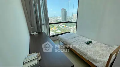 Modern bedroom with stunning city view and sleek furniture