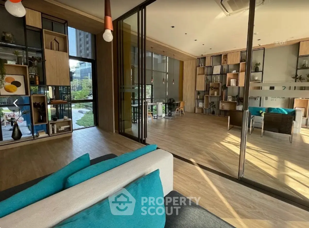 Modern living room with floor-to-ceiling windows and stylish decor