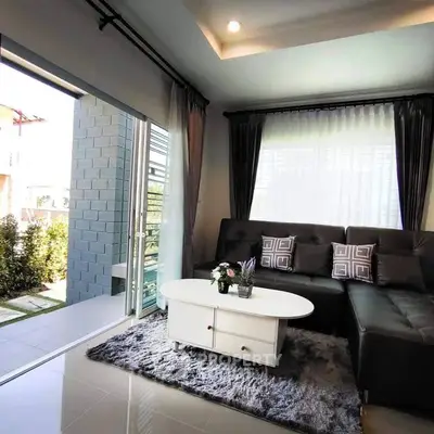 Stylish living room with modern decor and large windows for natural light.