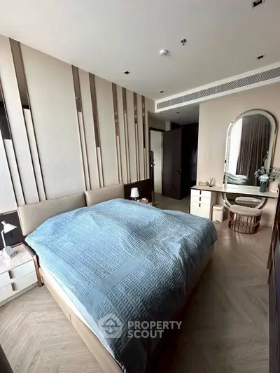 Luxurious bedroom with modern decor and elegant furnishings in a high-end apartment.