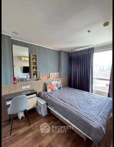 Modern bedroom with city view, featuring stylish decor and cozy ambiance.