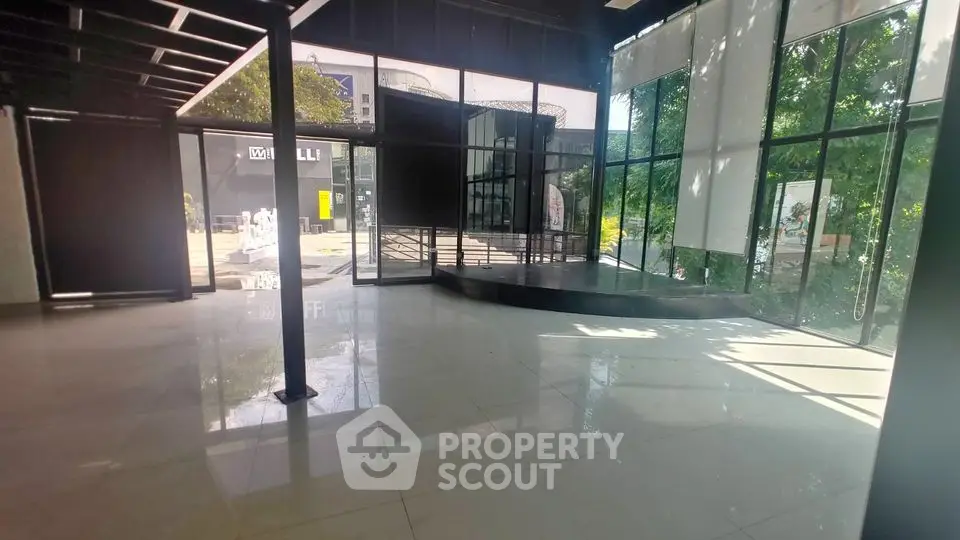 Spacious modern commercial space with large windows and natural light