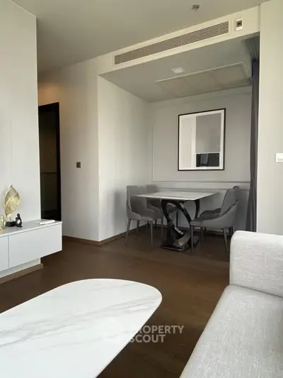 Modern living room with elegant dining area and stylish decor