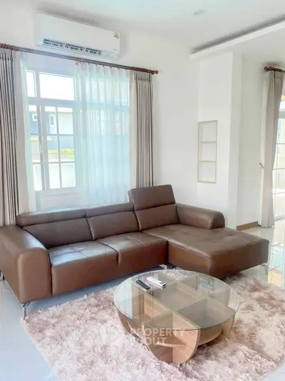 Modern living room with brown leather sofa and stylish coffee table